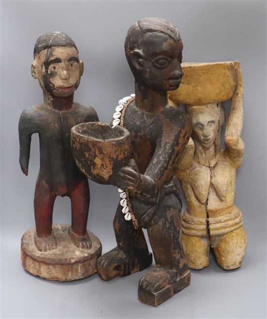 Three African carved and painted wood ethnographical figures tallest 59cm